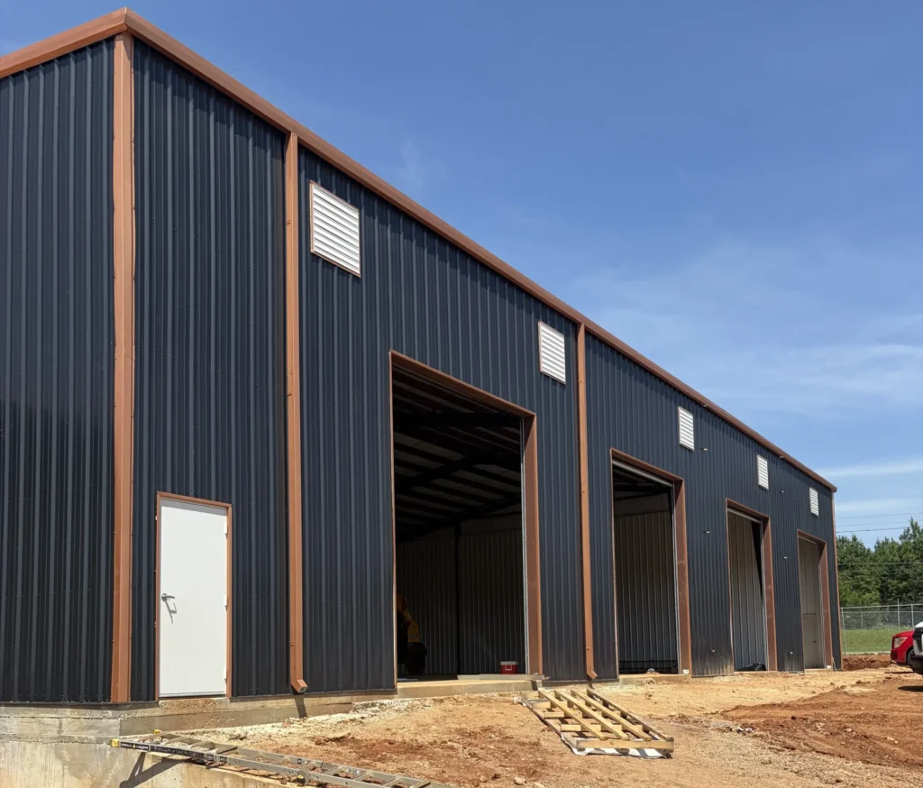 Pre-engineered metal building with overhead cranes at Morgan Truck Body by A & E Real Estate Development